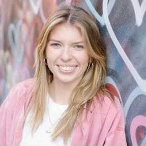 Portrait of CAROLINE RATEL, a professional stylist at Fringe Salon NY, showcasing their expertise and style.