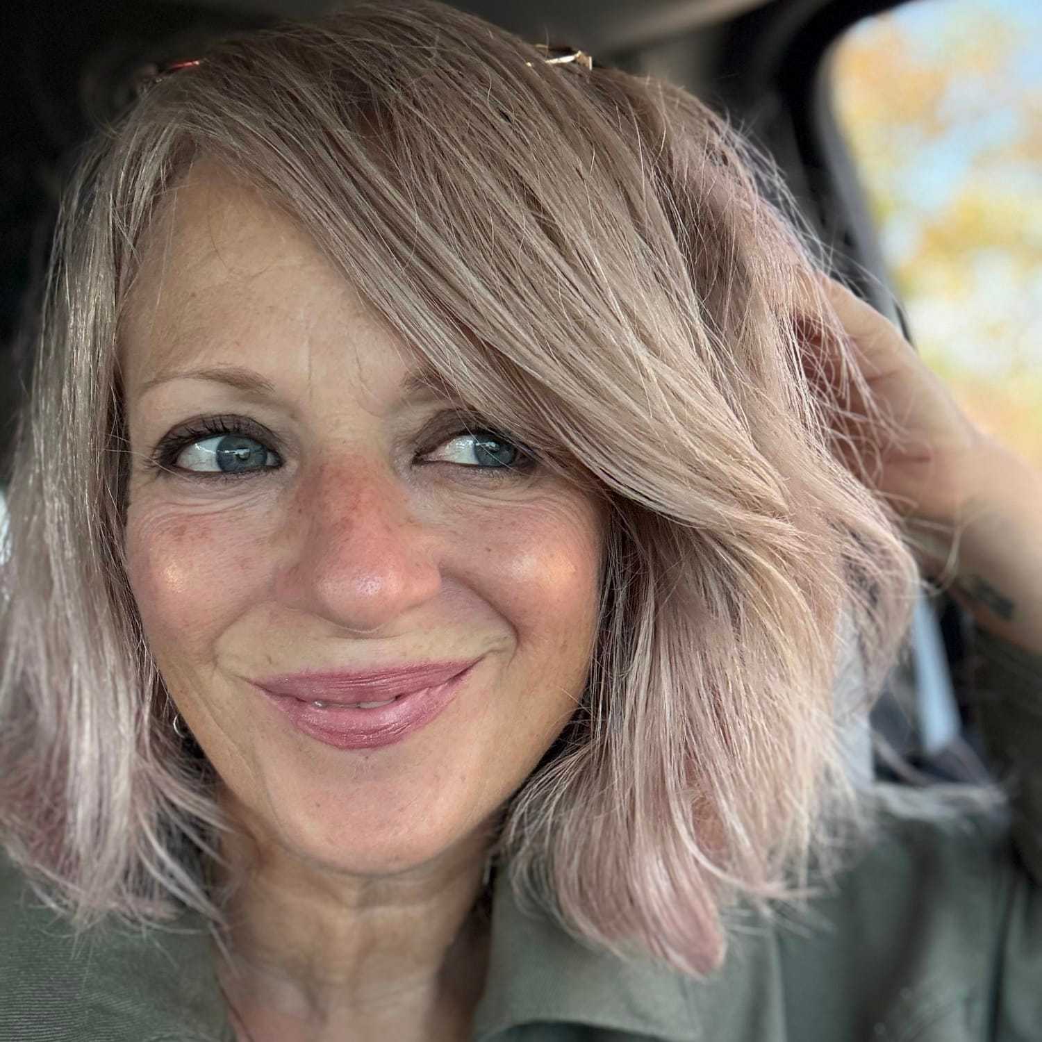 Portrait of BEAN, a professional stylist at Fringe Salon NY, showcasing their expertise and style.